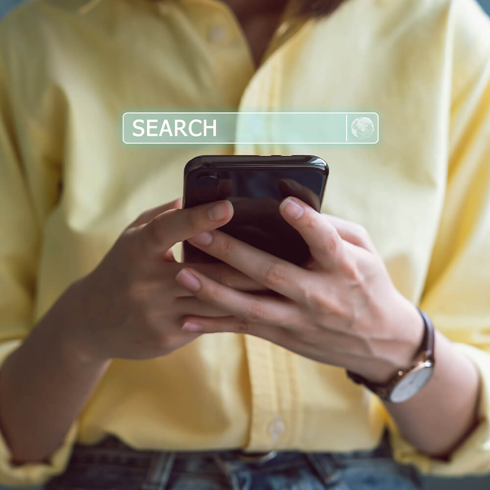 Woman searching google on mobile