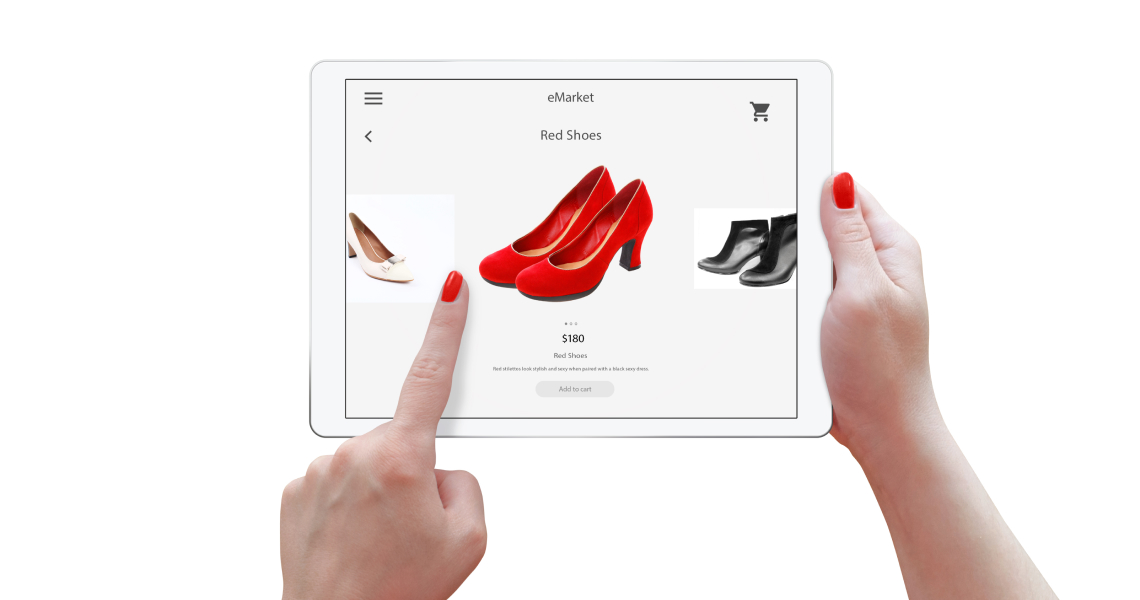 Woman pointing on red shoes on a website using tablet
