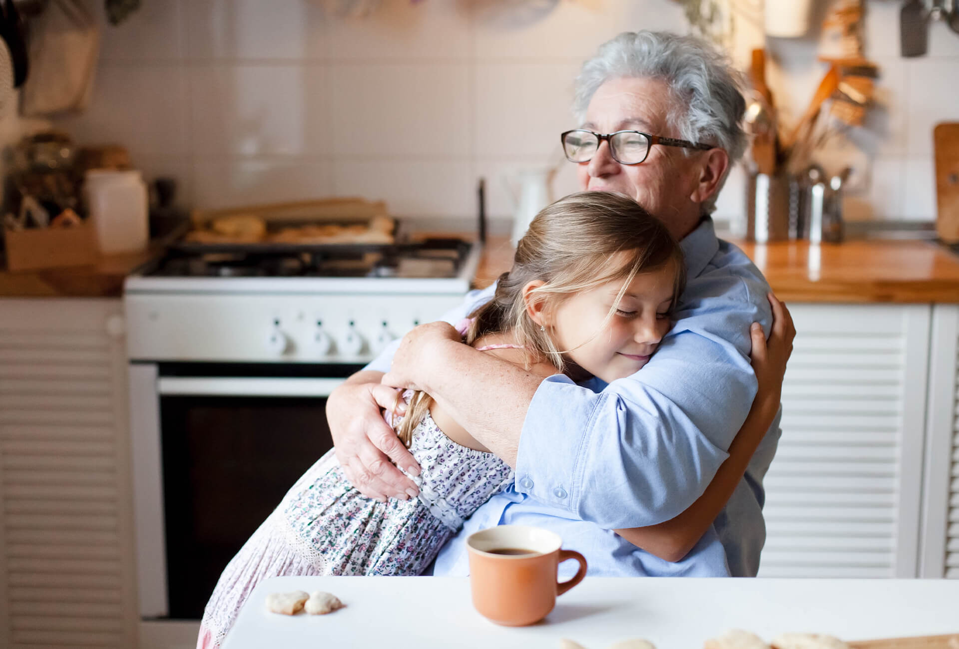 Grandmother hugs granddaughter