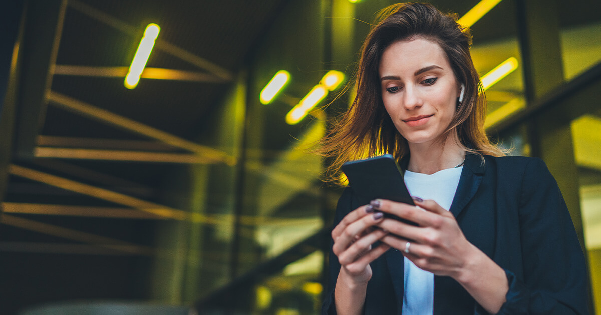 A woman texting on a phone