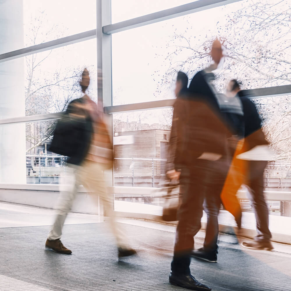 People walking through the hall